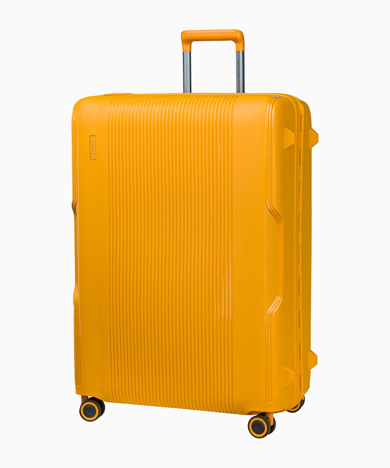 Велика жовта валіза закрита на пряжки