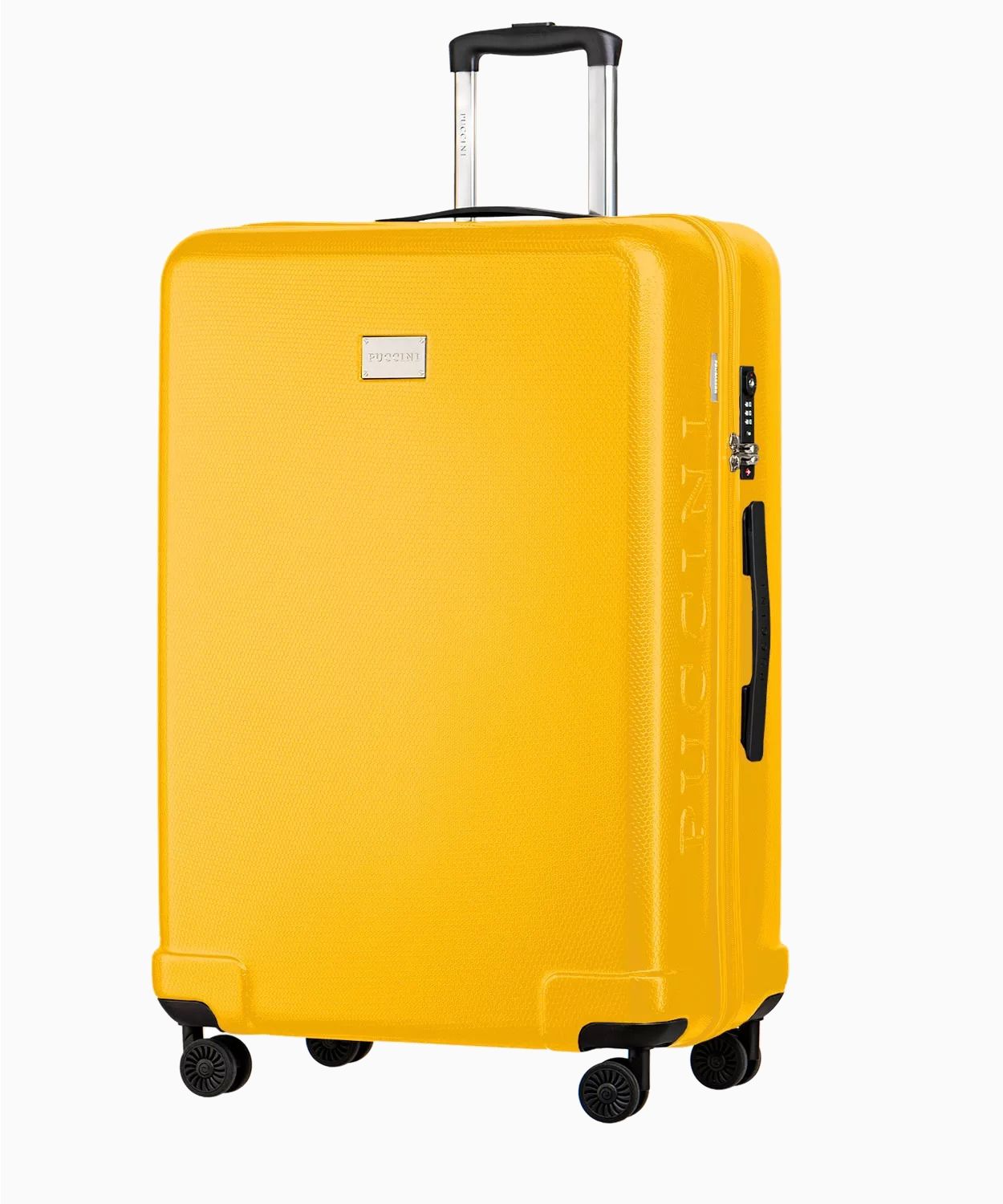 Велика жовта тверда валіза зі структурою медових сот